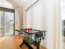 A games room with a foosball table and red cups at Bilsham Meadows, Aust