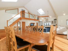 A dining room with a large table and chairs at Bilsham Meadows in Aust