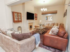 A living room with a sofa and coffee table at The Causeway in Llandudno