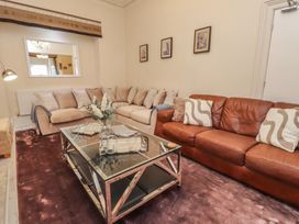 A living room with sofas and a coffee table at The Causeway in Llandudno
