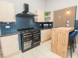 A kitchen with a cooking range and countertop at The Causeway in Llandudno