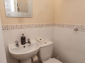 A bathroom with a sink and toilet at The Causeway in Llandudno