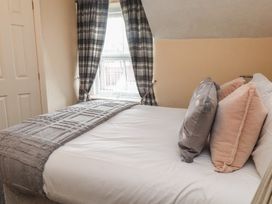A bedroom with a bed and pillows at The Causeway in Llandudno
