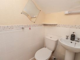 A bathroom with a toilet and sink at The Causeway in Llandudno