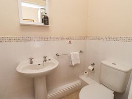 A bathroom with a sink and a toilet at The Causeway in Llandudno
