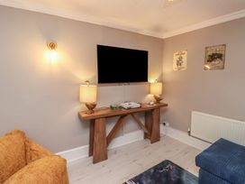 A snug with a tv and console table at The Causeway Llandudno