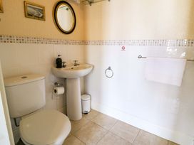 A bathroom with a sink and toilet at The Causeway in Llandudno