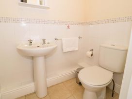 A bathroom with a sink and toilet at The Causeway in Llandudno