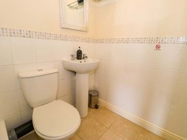 A bathroom with a toilet and sink at The Causeway in Llandudno