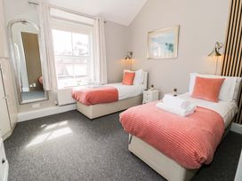 A bedroom with two beds at The Causeway in Llandudno