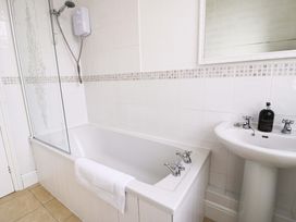 A bathroom with a bathtub and sink at The Causeway in Llandudno