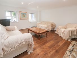 A living room with couches and a coffee table at Sunnyvale Cottage in Rosudgeon
