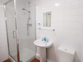 A bathroom with a shower, sink and toilet at Sunnyvale Cottage in Rosudgeon