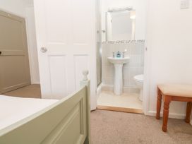 A bathroom featuring a shower, sink, and toilet at Sunnyvale Cottage in Rosudgeon