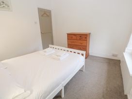 A bedroom with a bed and a dresser at Sunnyvale Cottage Rosudgeon
