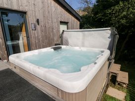 A hot tub on a deck at Cornerstones Brython in Tenby