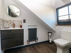 A bathroom with a wash basin and toilet at 11 Brython Place Tenby