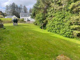 A garden area with grass and trees at James Neills Cottage in Ballylar near Downings