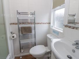A bathroom with toilet and sink at Seacroft in Stepaside near Kilgetty