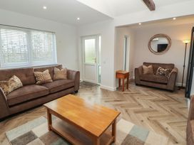 A living room with a sofa and coffee table at Mallard Cottage in Penrith
