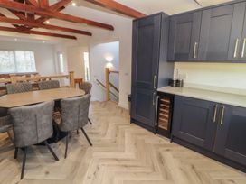 A dining area with a table and chairs at Mallard Cottage in Penrith