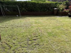 A garden with a goalpost and a football at The Furness Haven in Barrow-In-Furness