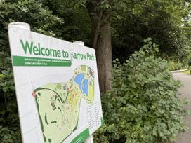 A welcome sign with map at Barrow Park in Barrow-In-Furness