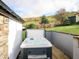 A hot tub in a garden at Ael Y Bryn in Ffestiniog
