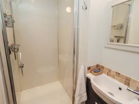 A bathroom with a shower and sink at Rose House in Alnmouth