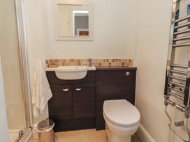 A bathroom with a sink and toilet at Rose House Alnmouth