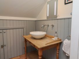 A bathroom with a sink and faucet at Rose House Alnmouth