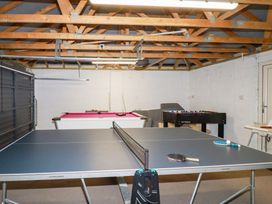 A game room with ping pong and pool tables at Lavender House Crantock