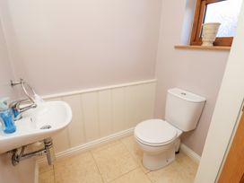A bathroom with a sink and toilet at The Stables at Hall Barn Wattisfield near Walsham-Le-Willows