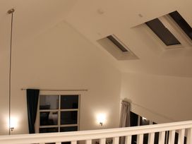 A room with skylights and curtains at Narracott Down, South Molton