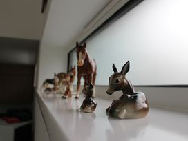 A display of animal figurines on a shelf at Narracott Down in South Molton