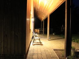 An outdoor area with a bench and table at Narracott Down in South Molton
