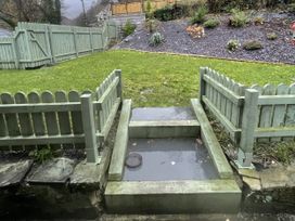 A garden with steps and a fence at Old Chapel House Abergwyngregyn near Llanfairfechan