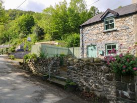 An exterior view of a stone house with garden at Old Chapel House in Abergwyngregyn near Llanfairfechan