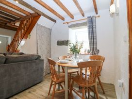 A dining area with a table and chairs at Old Chapel House Abergwyngregyn near Llanfairfechan
