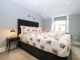 A bedroom with a bed and nightstand at Old Chapel House Abergwyngregyn near Llanfairfechan