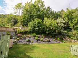 A garden with a sloped area featuring plants at Old Chapel House Abergwyngregyn near Llanfairfechan
