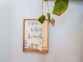 A framed wall art with beach theme at Riverdance Cottage in Lyme Regis