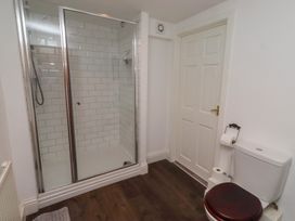 A bathroom with a shower and toilet at The Coach House Crookham near Cornhill-On-Tweed
