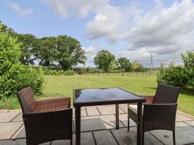 An outdoor area with a table and chairs at Lodge 3 in Strensall