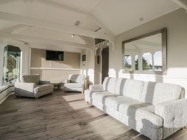 A living room with a sofa and armchairs at Valley View in Dalton-In-Furness