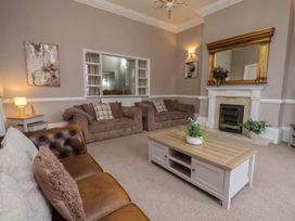 A living room with sofas and a coffee table at Bridlington Bay House in Bridlington