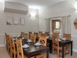 A dining room with tables and chairs at Bridlington Bay House in Bridlington