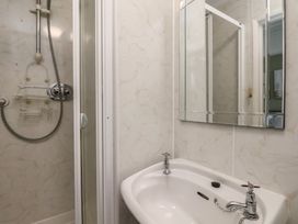 A bathroom with a shower and a sink at Bridlington Bay House in Bridlington