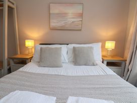 A bedroom with a bed and lamps at Bridlington Bay House in Bridlington