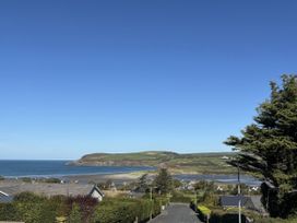 A view of the ocean and houses from a hill at Bryn Alaw in Newport, Pembrokeshire